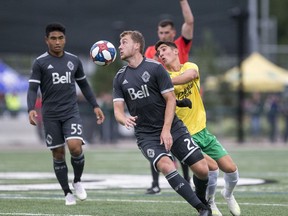 Brendan McDonough with Vancouver Whitecaps U-23 heads the ball away from the Saskatchewan Selects all-star squad during a SK Summer Series friendly soccer match in Saskatoon, SK on Thursday, July 25, 2019.