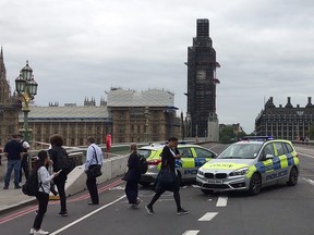 In this file video grab taken on August 14, 2018, taken from AFP TV video footage police officers cordon off Westminster Bridge, leading to Parliament Square in central London, after a car was driven into barriers at the Houses of Parliament. (WILLIAM EDWARDS/AFP/Getty Images)
