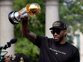 Toronto Raptors basketball player Kawhi Leonard hold his MVP trophy during the Raptors victory parade after defeating the Golden State Warriors in the 2019 NBA Finals, in Toronto, Ontario, Canada June 17, 2019.    REUTERS/Moe Doiron