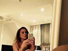 Lindsay Lohan taking a selfie in her birthday suit for her 34th birthday.