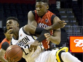 Saskatchewan Rattlers newcomer Shaquille Keith, shown here in this file photo playing for the Windsor Express and fighting for the ball against London Lightning player Tyshawn Patterson, scored 27 points in his CEBL debut with the Rattlers.