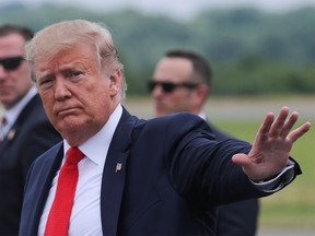 U.S. President Donald Trump returns waves after arriving in Morristown, New Jersey, U.S., July 5, 2019. REUTERS/Jonathan Ernst?