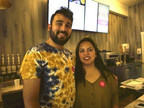 Vivek Patawari (left) and Roshni Jain stand behind the counter at their Yay! Thai restaurant in Saskatoon, Sask. on Aug. 23, 2019.