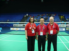 Yves Côté, right, stands with two other badminton officials at the 2007 Pan American Games in Rio de Janeiro, Brazil.