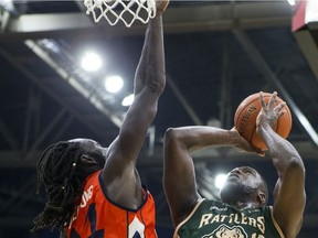 Saskatchewan Rattlers forward Ryan Ejim shoots the ball under pressure from Fraser Valley Bandits forward Ransford Brempong during first half CEBL action in Saskatoon, SK on Friday, August 2, 2019.