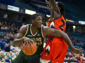 Saskatchewan Rattlers guard Shaquille Keith drives the ball under pressure from Fraser Valley Bandits forward Ransford Brempong during first half CEBL action in Saskatoon on Friday, August 2, 2019.