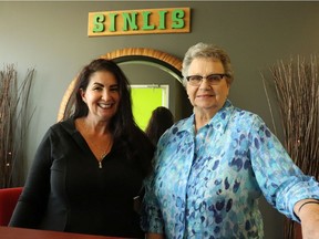 Cindy Tokar (left) and Shirlie Ursu stand at the entry to Sinlis Hair Studio in Regina. The two found out they're first cousins after a lengthy genealogical search. Photo by Ethan Williams