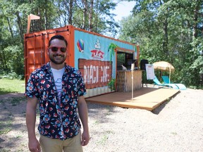 Joshua Turner stands outside JT's Beach Cafe at Blackstrap Lake, a fairly new pop-up style cafe that serves hot and cold treats. Turner said they hope to improve on the cafe next summer. Photo taken Aug. 2, 2019.