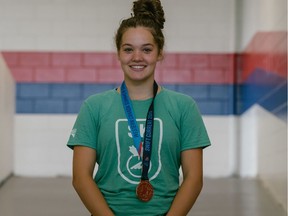 Moose Jaw swimmer Cadence Johns is shown with one of the two gold medals she won Saturday at the Western Canada Summer Games in Swift Current.