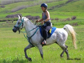 Lexi Vollman rides a horse she trained named Cali