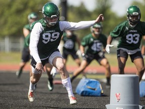 University of Saskatchewan Huskies defensive lineman Nicholas Dheilly, a former Regina Ram who has moved over to the Huskies this year, goes through drills during the first day of training-camp workouts at Griffiths Stadium in Saskatoon on Tuesday.