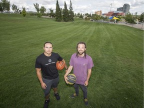 Michael Linklater, left, and Marcus Storey have approached Saskatoon city hall about building an outdoor basketball court in Victoria Park in Saskatoon, SK on Tuesday, August 13, 2019.