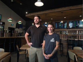 Glenn Valgardson, left, Pile O' Bones Brewing's general manager, and Kate Byblow, taproom manager, stand in the company's an new taphouse.