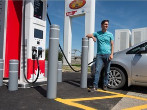 Adrian Dean, a member of the Saskatchewan Electric Vehicle Association, charges his 2011 Nissan Leaf at Petro-Canada's EV Fast Charge station on the city's east end.
