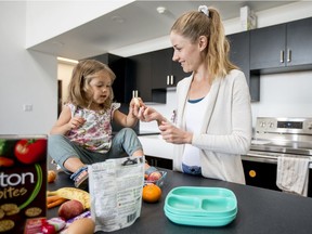 Nutritionist Alison Friesen, right, and her daughter Blakely pack a healthy lunch in Saskatoon, SK on Friday, August 23, 2019.