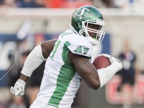 Saskatchewan Roughriders defensive lineman Earl Okine returns a fumble for a touchdown Aug. 9 during a 17-10 victory over the host Montreal Alouettes.