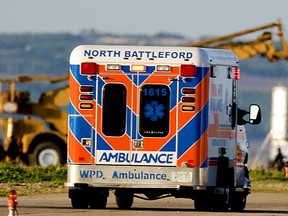 Michel Fournier is being taken in an ambulance to the capsule in the distance to prepare for his trip in the capsule guided by a helium balloon 40 km above the earth before free falling and then parachuting back to the earth Monday morning in the clear blue skys of North Battleford, Sask. He will spend 2 hours in the capsule before launch breathing only oxygen to prepare himself. StarPhoenix photo by Gord Waldner