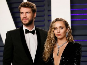 FILE PHOTO: 91st Academy Awards – Vanity Fair – Beverly Hills, California, U.S., February 24, 2019 – Liam Hemsworth and Miley Cyrus. REUTERS/Danny Moloshok/File Photo