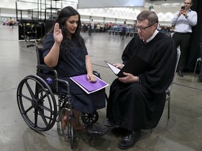 Tatev, 31, went into labour before her U.S. citizenship ceremony and refused to go to hospital until she was sworn in, according to Judge Cormac J. Carney who is seen performing a quick naturalization ceremony before the official event in Los Angeles August 22, 2019. (REUTERS/Lucy Nicholson)