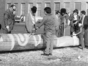 CP-Web. A totem pole, which was created and gifted to the city of Prince Albert, Sask., by a group of inmates from Saskatchewan Penitentiary in 1975, is being returned close to the penitentiary after it was removed due to the base rotting and creating a safety concern. Inmates work on crafting a totem pole at the Saskatchewan Penitentiary in a 1975 handout photo. Dale Stonechild sits carving at right while James Sutherland sits on the far left, also carving.