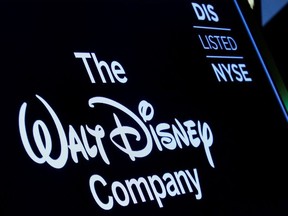 A screen shows the logo and a ticker symbol for the Walt Disney Company on the floor of the New York Stock Exchange (NYSE) in New York, U.S., December 14, 2017.
