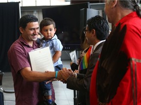 Miroslav Ilchev and his son Christian (from Yugoslavia) are now Canadian Citizens, August 22, 2019. Immigration, Refugees and Citizenship Canada and the Institute for Canadian Citizenship (ICC) welcome 50 new citizens at a special citizenship ceremony at the Lansdowne – Horticultural Building. Photo by Jean Levac/Postmedia News
