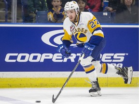 Saskatoon Blades defence Nolan Kneen moves the puck against the Prince Albert Raiders during the first period of WHL action at SaskTel Centre in Saskatoon, SK on Tuesday, April 9, 2019.