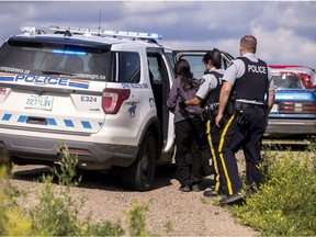 RCMP Crime Reduction Team members pull over a car in Onion Lake First Nations, SK on Wednesday, July 17, 2019. The officer took one person into custody for out standing warrants.