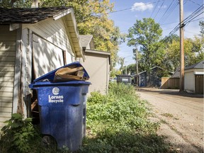 Single-family home recycling bins await pickup in the back alley of Main Street in Saskatoon, SK on Friday, September 6, 2019.