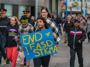 A group of supporters march throughout downtown raising awareness for FASD on Monday, Sept. 9, 2019 in Saskatoon, Sask.