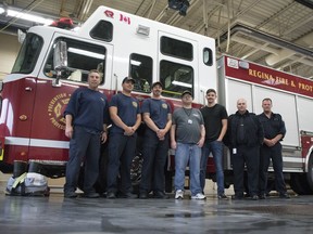 4to40 employee Peter Rhodes, fourth from left, who has an intellectual disability, stands with his job coach Connor Brown, fifth from left, and the day crew at Fire Hall 2 in Regina. The 4to40 program "is an initiative to connect people experiencing disability with forward-thinking employers."