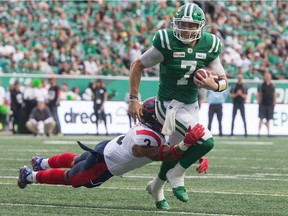 Saskatchewan Roughriders quarterback Cody Fajardo is tackled by Montreal Alouettes linebacker Patrick Levels (3) during Saturday's game at Mosaic Stadium.