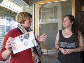 NDP incumbent Sheri Benson speaks with Laura Edna Lacey while canvassing in Saskatoon earlier this week. Benson has held Saskatoon West since 2015, and is looking to secure a second term.