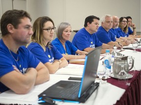 Chris Macdonald, fourth from left, assistant to the national president of Unifor, sits with the bargaining committee for Sasktel employees at the Delta Hotel in Regina. TROY FLEECE / Regina Leader-Post