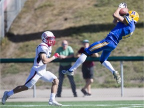 Saskatoon Hilltops receiver Connor Graham makes a leaping catch for the Saskatoon Hilltops against the Calgary Colts during PFC action at Saskatoon Minor Football Field on Sunday, September 22, 2019