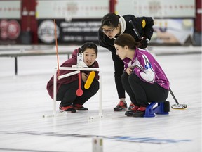 Mao Ishigaki (left), Yuna Kotani and Arisa Kotani practice at Nutana Curling Club Tuesday afternoon.