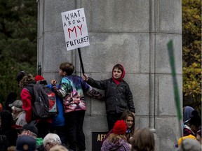 David McLellan holds a sign a climate rally held outside of City Hall. Photo taken in Saskatoon, SK on Friday, September 27, 2019.