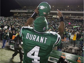 Darian Durant celebrates after quarterbacking the Saskatchewan Roughriders to first place in the CFL's West Division in 2009.