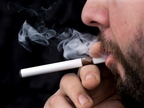 The Saskatchewan Government says it's keeping an eye out for vaping-related illnesses after a serious case was reported in Ontario and hundreds more cases have been recorded in the United States including seven deaths. A smoker puffs on an electronic cigarette in Halifax on Friday, Feb. 7, 2014.