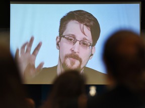 Former U.S. National Security Agency contractor and whistleblower Edward Snowden speaks via video link from Russia on March 15, 2019. (FREDERICK FLORIN/AFP/Getty Images)