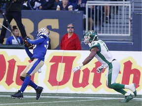 The Winnipeg Blue Bombers' Winston Rose, left, intercepted a pass intended for the Saskatchewan Roughriders' Shaq Evans on Saturday.