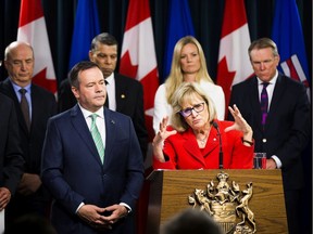Premier Jason Kenney listens to Janice MacKinnon, a former Saskatchewan finance minister, and chair of a blue-ribbon panel announced to examine the Alberta government's financial situation. Taken on Tuesday, May 7, 2019, in Edmonton.