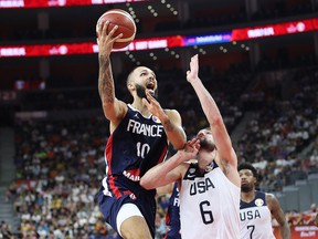 Evan Fournier of France puts up a shot as Joe Harris of the U.S.A. defends during the FIBA World Cup quarterfinal at Dongguan Basketball Center on September 11, 2019 in Dongguan, China. (Lintao Zhang/Getty Images)