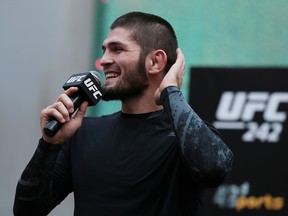 Khabib Nurmagomedov talks on the microphone during the UFC 242 open workouts at Yas Mall in Abu Dhabi, United Arab Emirates, September 4, 2019. (REUTERS/Christopher Pike)