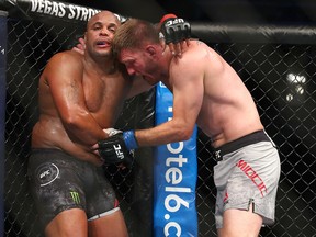 Stipe Miocic grapples with Daniel Cormier during their UFC heavyweight title fight at UFC 241 at Honda Center on August 17, 2019 in Anaheim. (Joe Scarnici/Getty Images)