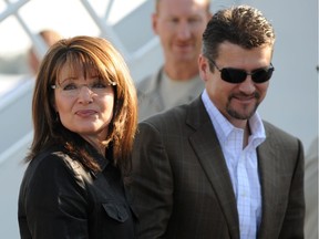 (Oct. 2, 2008 file photo) Republican vice-presidential candidate Sarah Palin arrives with and her husband Todd Palin at the Flagstaff, Arizona airport.