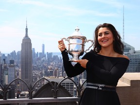 Bianca Andreescu of Canada poses with her trophy at the Top of the Rock in Rockefeller Center on September 8, 2019 in New York City.