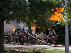 Saskatoon fire fighters respond to a structure fire on Crescent Boulevard in Saskatoon's Montgomery neighbourhood on July 22, 2018. (Liam Richards/ Saskatoon StarPhoenix)