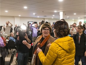 Sheri Benson speaks with NDP supporters after losing Saskatoon West to Conservative Brad Redekopp, a loss she and other insiders are chalking up to anti-Liberal sentiment in the province.