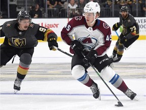 Bowen Byram (No. 45) of the Colorado Avalanche skates with the puck against Cody Glass (9) of the Vegas Golden Knights in the second period of their pre-season game at T-Mobile Arena on September 25, 2019 in Las Vegas, Nevada.